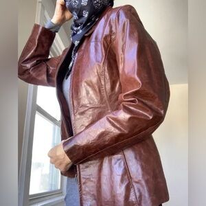 Women’s size medium Terry Lewis 100% leather cognac color zip up jacket